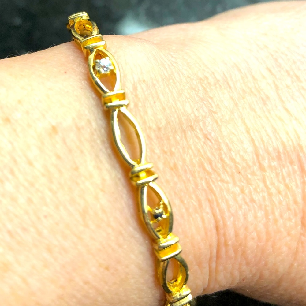 This Silver Gold plated Bracelet with diamond and sapphire accents is Beautiful.